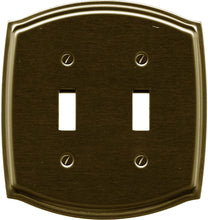 Load image into Gallery viewer, Antique Brass Plated Wallplate, polished sheen finish, elegant Colonial curved pattern, double toggle configuration. 4 1/8" x 4.625", 10.48cm x 11.75cm