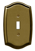 Load image into Gallery viewer, Antique Brass Plated Wallplate, polished sheen finish, elegant Colonial curved pattern, single toggle configuration. 4 1/8" x 2 7/8", 10.48cm x 7.30cm.