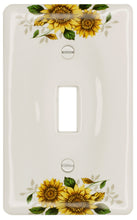 Load image into Gallery viewer, Kiln fired gloss white ceramic porcelain wall plate. One of a Kind fresh country Sunflower floral pattern on the cover plate for bathroom, spa, or kitchen. high quality and durability. Stays white and gleaming for years to come. Single Toggle cover plate configuration. Screws Included. Easy to clean with a damp cloth. Do not over tighten screws to avoid cracking the plate. Do not use automatic screwdrivers.