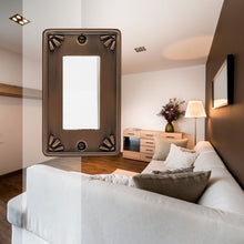 Load image into Gallery viewer, Metal Studio Antique Bronze Single Rocker Wall-plate on a background image of a bright, wood furnished living room