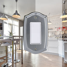 Load image into Gallery viewer, Decorative Metal Etched Steel on Chrome Single Rocker Wall Plate in front of a brightly lit white kitchen
